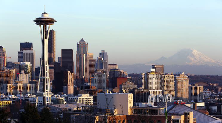 The Space Needle and Mount Rainier pictured at dusk in Seattle, on March 12, 2014. (Photo: Jason Redmond/Reuters)