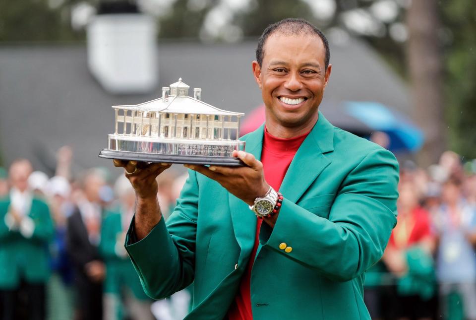 Tiger Woods celebrates during the trophy presentation on April 14, 2019, after winning the Masters at Augusta National Golf Club in Augusta, Georgia. [Allen Eyestone/for the Augusta Chronicle]