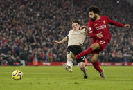 Liverpool's Mohamed Salah, right, shoots to score his side's second goal during the English Premier League soccer match between Liverpool and Manchester United at Anfield Stadium in Liverpool, Sunday, Jan. 19, 2020.(AP Photo/Jon Super)