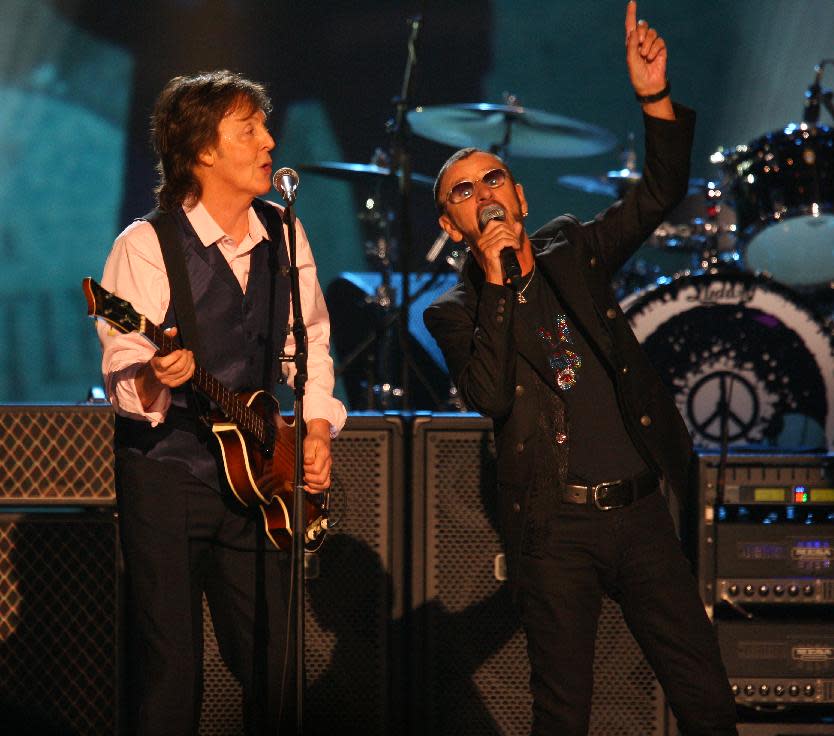 Paul McCartney and Ringo Starr perform at The Night that Changed America: A Grammy Salute to the Beatles, on Monday, Jan. 27, 2014, in Los Angeles. (Photo by Zach Cordner/Invision/AP)