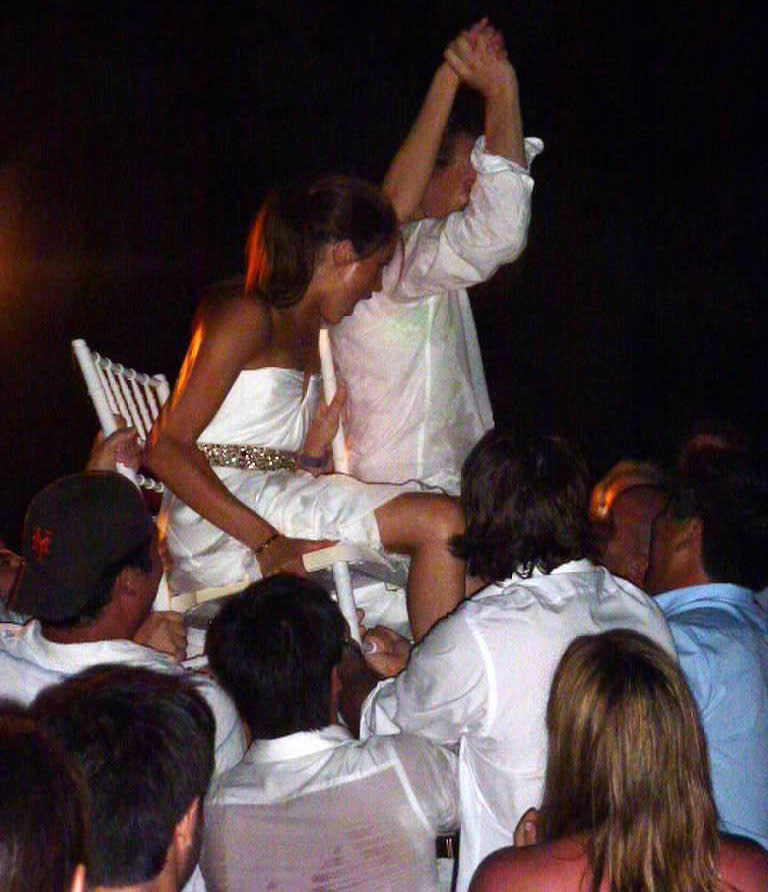 <span>The bride and groom were pictured being hoisted up on chairs by their guests. </span>Photo: Mega