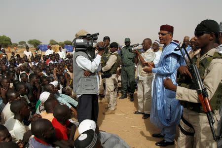 Niger's Interior Minister Mohamed Bazoum speaks to people at the Boudouri site for displaced persons, outside the town of Diffa, in southeastern Niger, June 18, 2016. Picture taken June 18, 2016. REUTERS/Luc Gnago