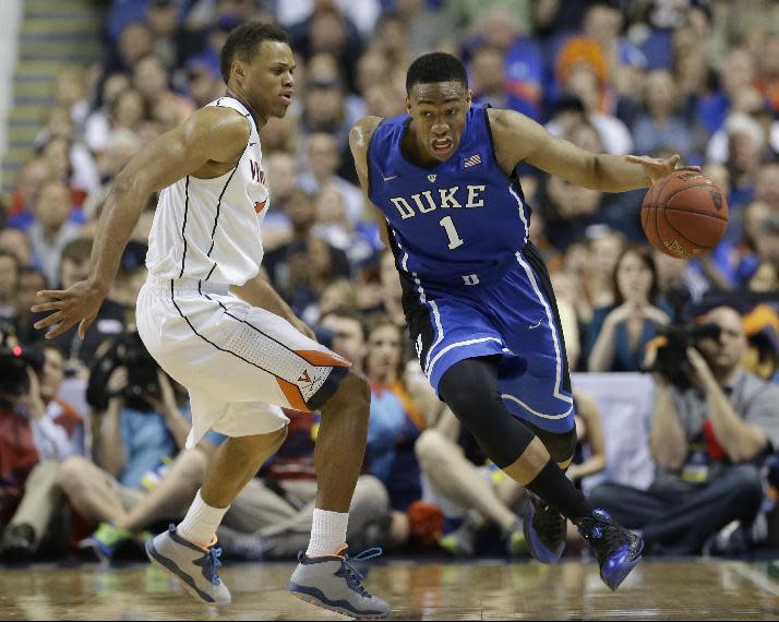 FILE - In this March 16, 2014 file photo, Duke's Jabari Parker, right, drives past Virginia's Justin Anderson during the second half of an NCAA college basketball game in the championship of the Atlantic Coast Conference tournament in Greensboro, N.C. Parker is entering the NBA draft, and there's a strong chance he'll be the No. 1 pick. (AP Photo/Gerry Broome, File)