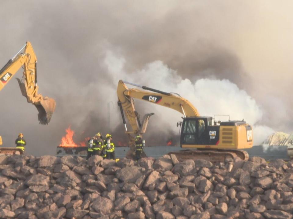 Donald MacRae, the owner of a trucking and backhoe business, provided heavy equipment to help put out the fire at Atlantic Aqua Farms in Orwell Cove. (Tony Davis/CBC - image credit)