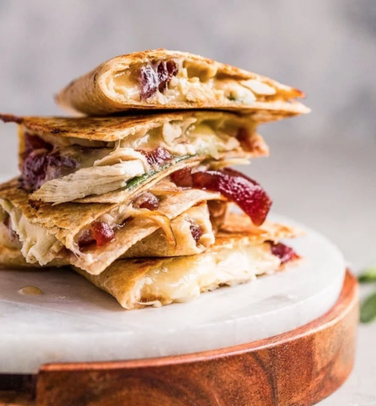 <p>The Cookie Rookie</p><p>We all need some ideas to use up the extra food from the big feast, and this three-cheese turkey, cranberry, and sage quesadilla is the solution. Skip the sandwich and use this Thanksgiving leftover recipe instead! </p><p><strong>Get the recipe: <a href="https://www.thecookierookie.com/thanksgiving-leftovers-quesadilla/" rel="nofollow noopener" target="_blank" data-ylk="slk:Thanksgiving Leftovers Quesadilla;elm:context_link;itc:0;sec:content-canvas" class="link rapid-noclick-resp">Thanksgiving Leftovers Quesadilla</a></strong></p>