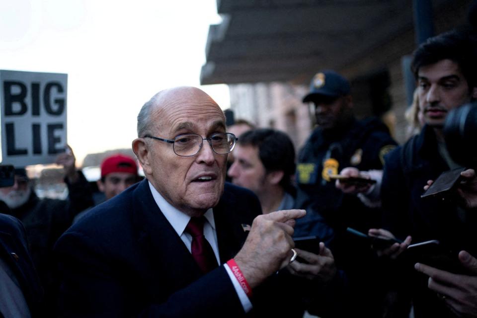 Rudy Giuliani was pictured leaving a courthouse in Washington DC after a jury ordered him to pay $148m for defaming a pair of election workers.  (CHARACTERISTICS)