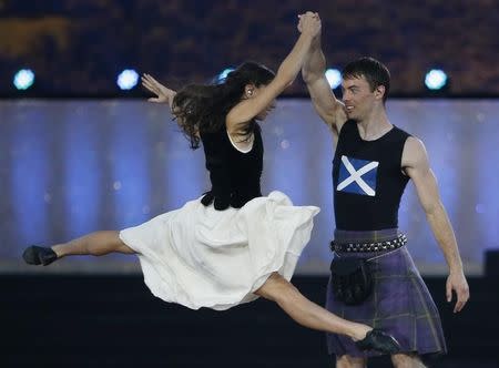 Performers take part in the opening ceremony for the 2014 Commonwealth Games at Celtic Park in Glasgow, Scotland, July 23, 2014. REUTERS/Jim Young