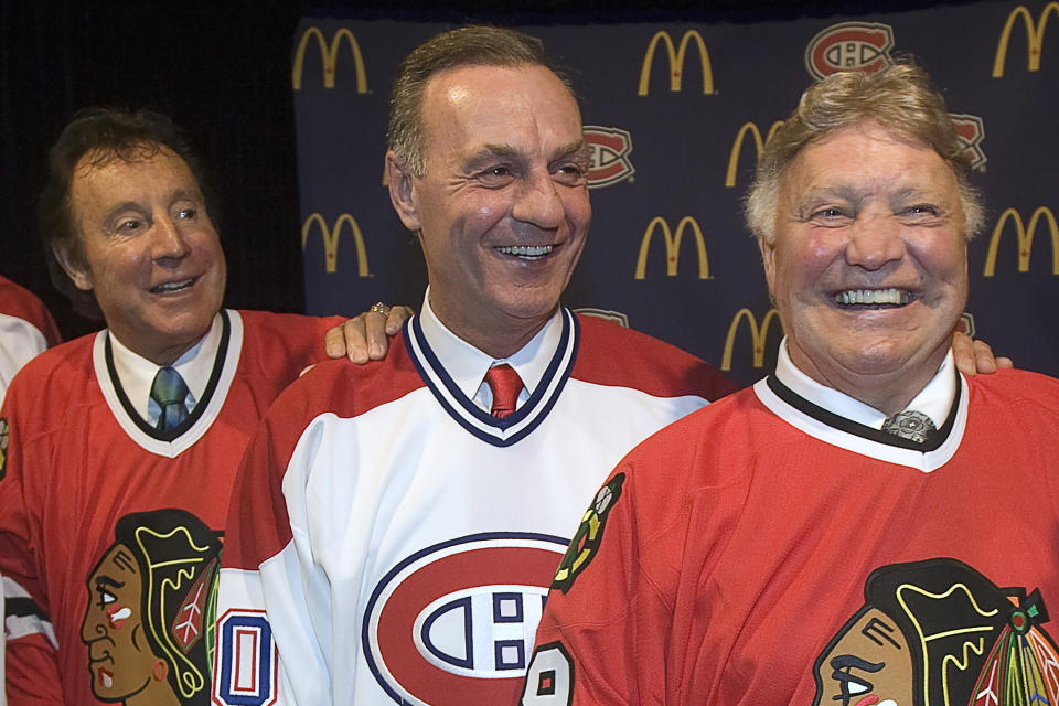 FILE - Hockey legends Tony Esposito, left, Guy Lafleur and Bobby Hull, right, pose for a photograph prior to a ceremony, Tuesday, Jan. 8, 2008, in Montreal. Hockey Hall of Famer Guy Lafleur, who helped the Montreal Canadiens win five Stanley Cup titles in the 1970s, died Friday, April 22, 2022, at age 70. (AP Photo/The Canadian Press, Paul Chiasson, File)