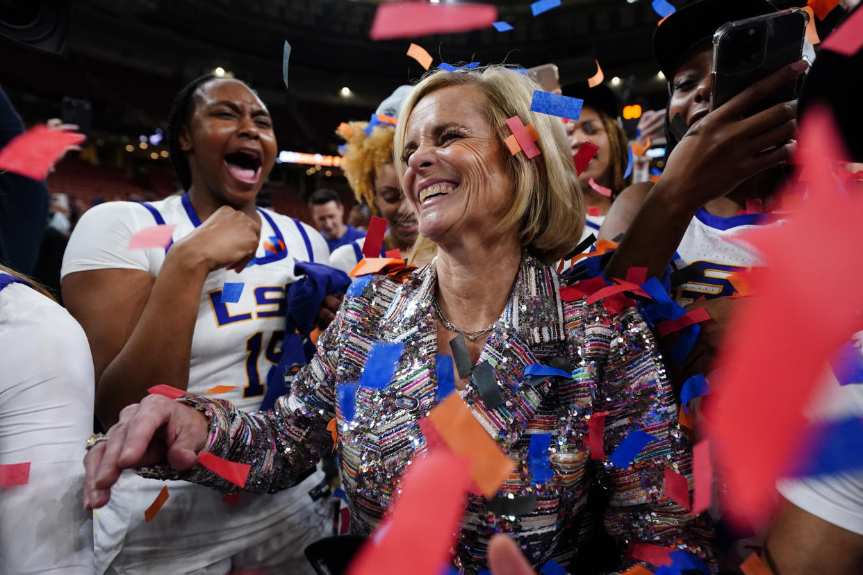 LSU head coach Kim Mulkey celebrates with her team after earning a spot in the Final Four of the NCAA women's tournament. (Jacob Kupferman/NCAA Photos via Getty Images)