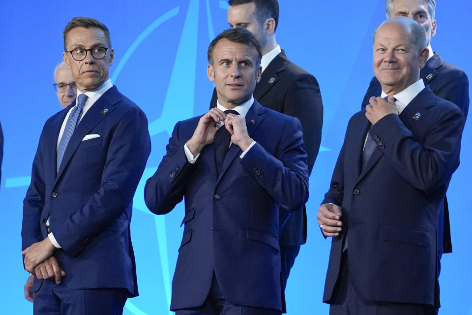 From left, Finland's President Alexander Stubb, French President Emmanuel Macron and Germany's Chancellor Olaf Scholz stand on stage before a family photo at the NATO Summit, Wednesday, July 10, 2024, in Washington. (AP Photo/Evan Vucci)