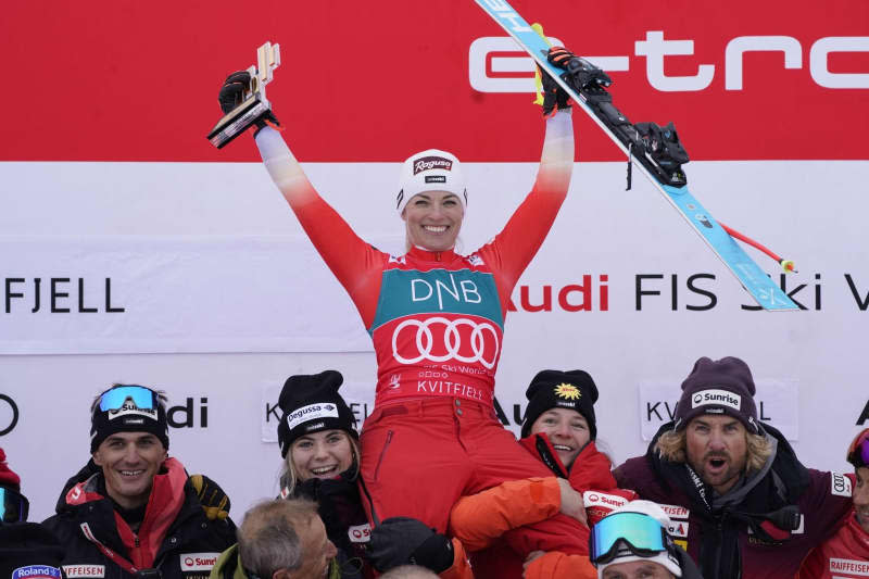 Switzerland's Lara Gut-Behrami (C) celebrates after her victory in the Women's downhill and super-G at the Ski Alpine World Cup in Kvitfjell. Erik Flaaris Johansen/NTB/dpa