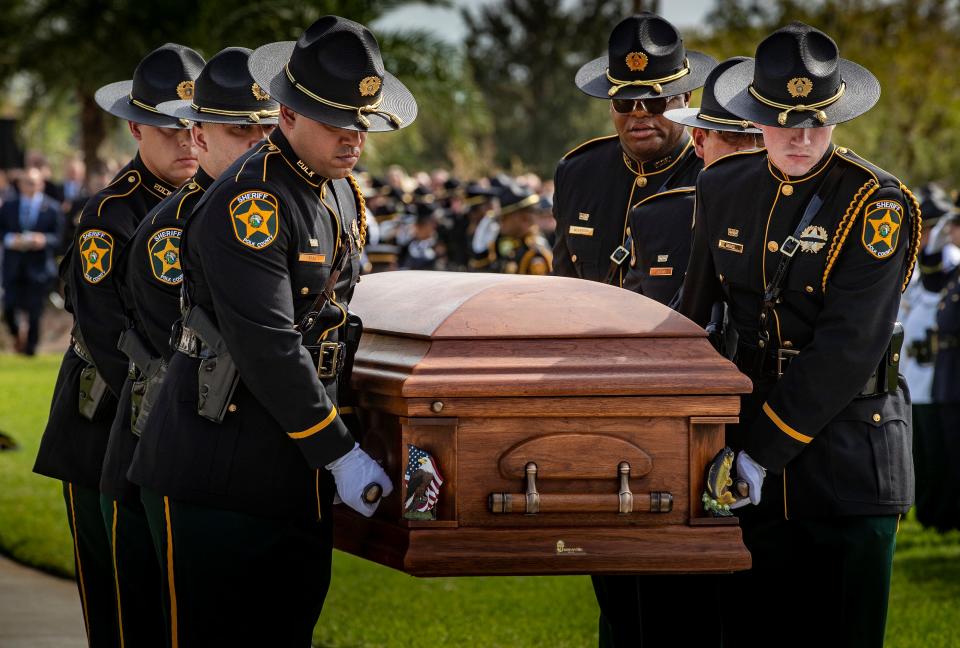 Sheriff's personnel carry the casket of Deputy Blane Lane during the funeral service on Tuesday.