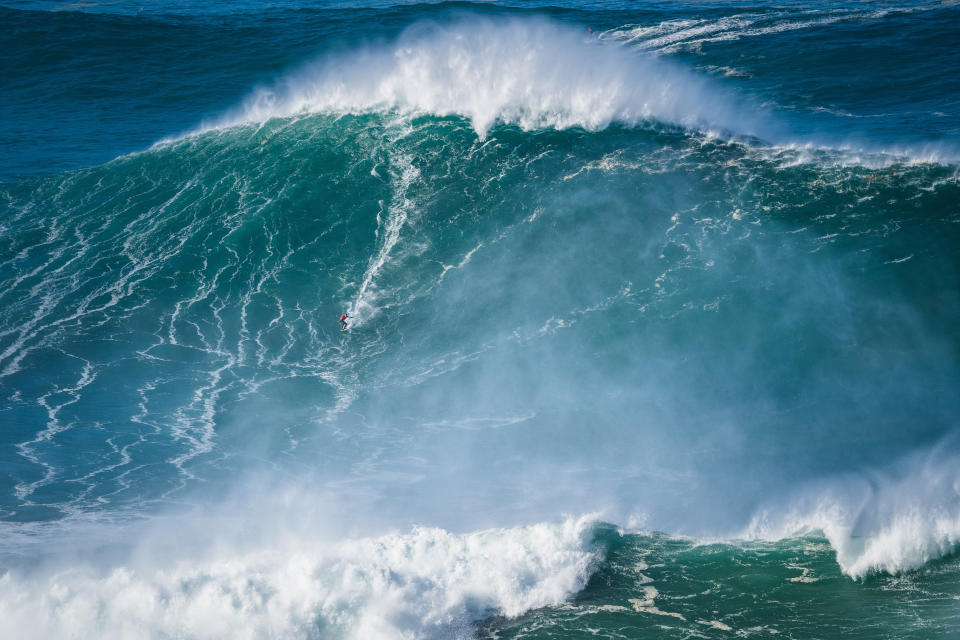 NAZARE, PORTUGAL - 2020/10/29: Big wave surfer Mason Hyce Barnes from USA rides a wave during a tow surfing session at Praia do Norte on the first big swell of winter season. (Photo by Henrique Casinhas/SOPA Images/LightRocket via Getty Images)