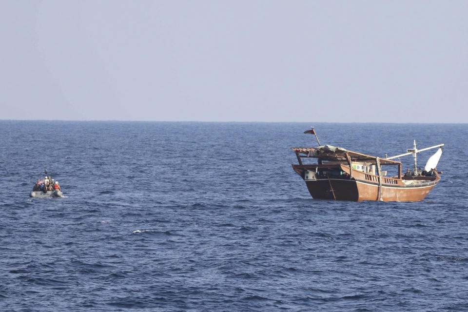 In this photo release by U.S. Navy, a boarding team from patrol coastal ship USS Chinook approaches a fishing vessel in international waters off the Gulf of Oman, Jan. 6, 2023. The U.S. Navy has seized over 2,100 assault rifles from a ship in the Gulf of Oman it believes came from Iran and were bound for Yemen's Iran-backed Houthi rebels. (U.S. Navy via AP)