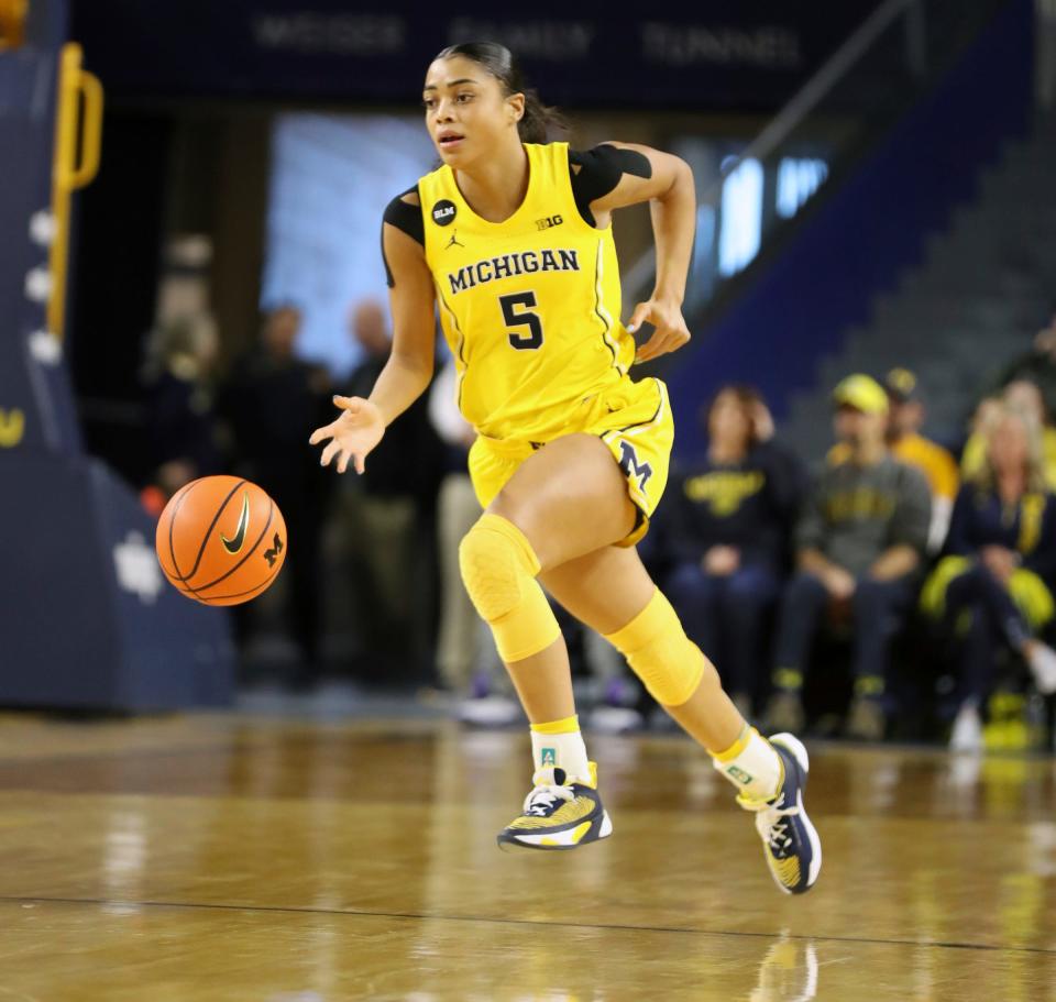 Michigan Wolverines guard Laila Phelia (5) brings the ball up court against the Michigan State Spartans during third-quarter action at Crisler Center in Ann Arbor on Saturday, Jan. 14, 2023.
