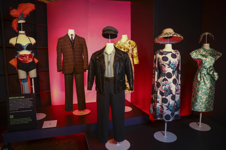 Costumes from the TV series "The Marvelous Mrs. Maisel" are displayed at the "Showstoppers! Spectacular Costumes from Stage & Screen" exhibit, benefitting the Costume Industry Coalition Recovery Fund, in Times Square on Monday, Aug. 2, 2021, in New York. (Photo by Andy Kropa/Invision/AP)