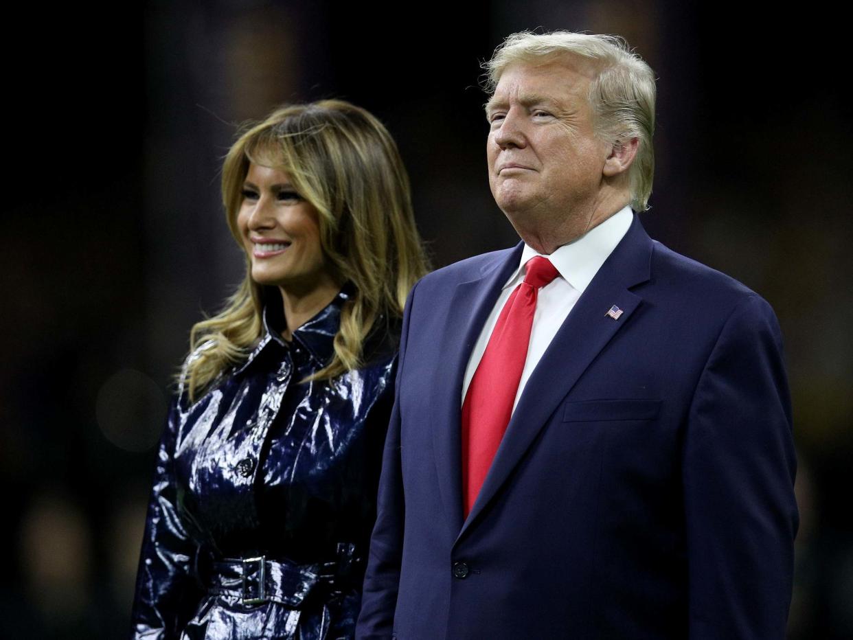 Donald and Melania Trump attend the College Football Playoff National Championship game between the Clemson Tigers and the LSU Tigers at Mercedes Benz Superdome on 13 January 2020 in New Orleans, Louisiana: Chris Graythen/Getty