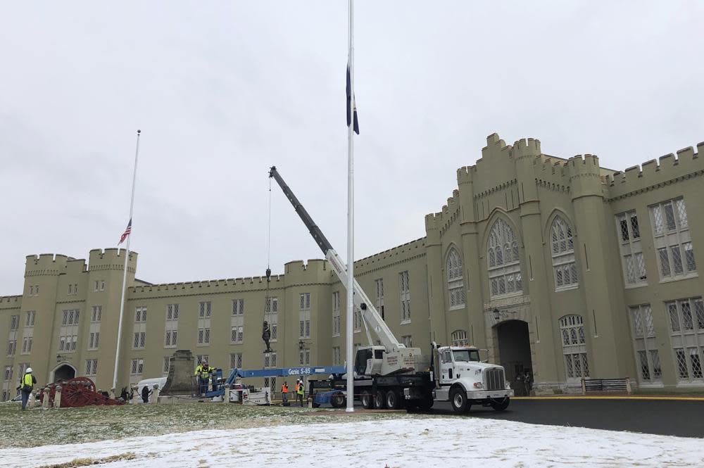 Crews lift a statue of Confederate Gen. Thomas “Stonewall” Jackson from its pedestal on the campus of the Virginia Military Institute in Lexington, Va., in this Dec. 7, 2020, file photo. (AP Photo/Sarah Rankin, File)