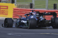 Mercedes driver Lewis Hamilton of Britain steers his car with the puncture in the finish area during the British Formula One Grand Prix at the Silverstone racetrack, Silverstone, England, Sunday, Aug. 2, 2020. (Ben Stansall/Pool via AP)