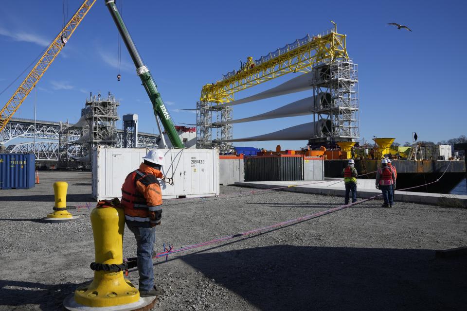 A generator and its blades are prepared at State Pier in New London, Conn., Monday, Dec. 4, 2023, to head to the ocean for the South Fork Wind farm. (AP Photo/Seth Wenig)