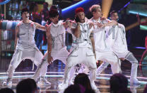 File - This Oct. 17, 2019, file photo shows Christopher Velez, from left, Joel Pimentel, Richard Camacho, Zabdiel de Jesuz, Erick and Brian Colon, of CNCO, performing at the Latin American Music Awards in Los Angeles. The Latin American boy band CNCO is downsizing. The group announced on its official Instagram page Sunday, May 9, 2021, that 22-year-old Pimentel is leaving the band, making the successful quintet a quartet. (Photo by Chris Pizzello/Invision/AP, File)
