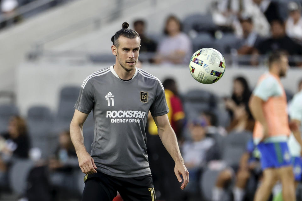 FILE - Los Angeles FC forward Gareth Bale warms up prior to the team's MLS soccer match against the Seattle Sounders on Friday, July 29, 2022, in Los Angeles. Gareth Bale feels fitter and happier since joining MLS team Los Angeles FC and is hoping that helps his performances for Wales going into the World Cup. Bale chose to move to the United States to get the most out of the final years of his career for club and country after some tough times at Real Madrid. (AP Photo/Ringo H.W. Chiu, File)