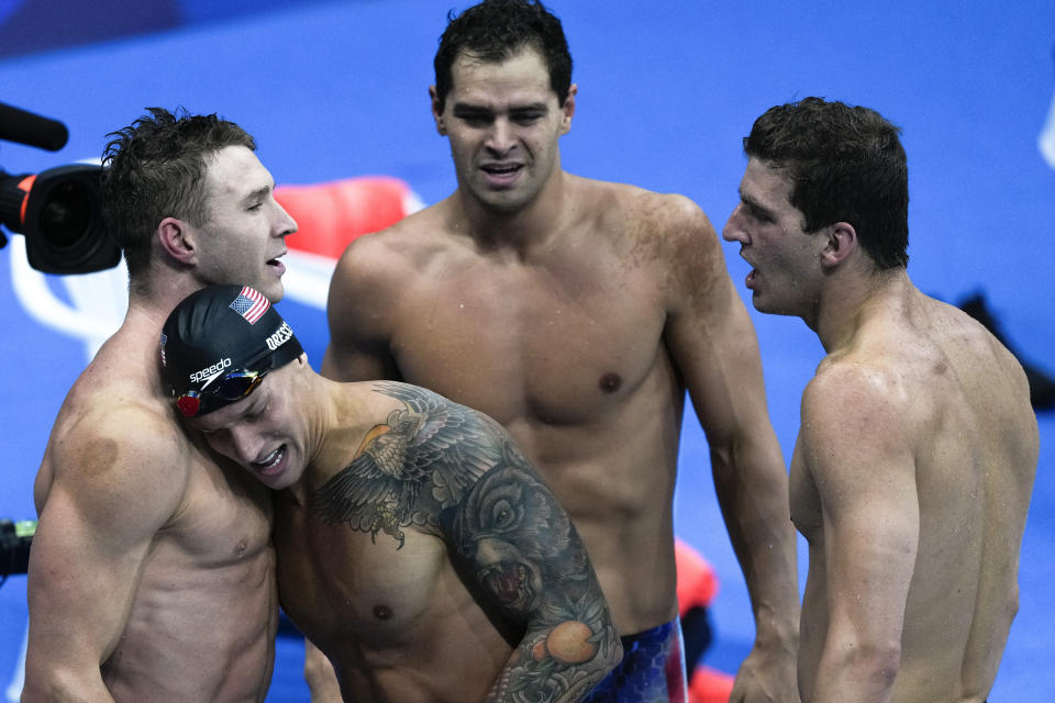 The United States' men's 4x100-meter medley relay team, Caeleb Dressel, Zach Apple, Ryan Murphy and Michael Andrew, celebrates winning the gold medal at the 2020 Summer Olympics, Sunday, Aug. 1, 2021, in Tokyo, Japan. (AP Photo/Jae C. Hong)