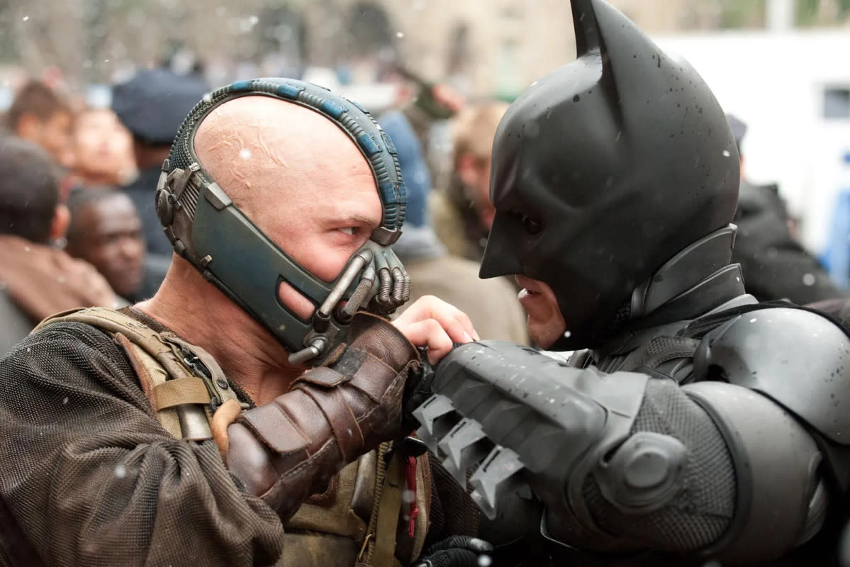 Tom Hardy as Bane and Christian Bale as Batman in "The Dark Knight Rises"<p>Warner Bros.</p>