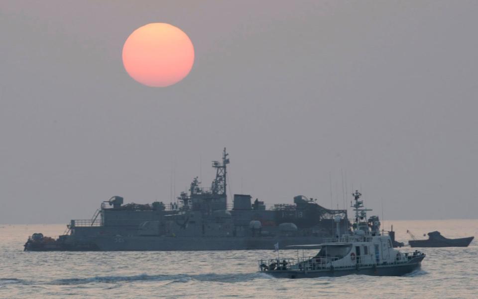 The official disappeared from a government ship near the military boundary between North and South Korea  - AP