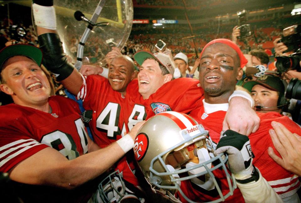 From left, Brent Jones, William Floyd, Steve Young and Merton Hanks celebrate after Super Bowl XXIX.