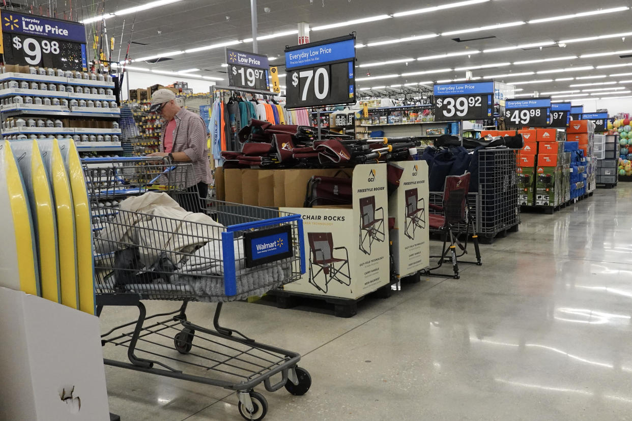 HALLANDALE BEACH, FLORIDA - FEBRUARY 20: A customer shops in a Walmart Supercenter on February 20, 2024 in Hallandale Beach, Florida. Walmart reported that quarterly revenue rose 6%, and that the company’s global e-commerce sales have also grown. (Photo by Joe Raedle/Getty Images)