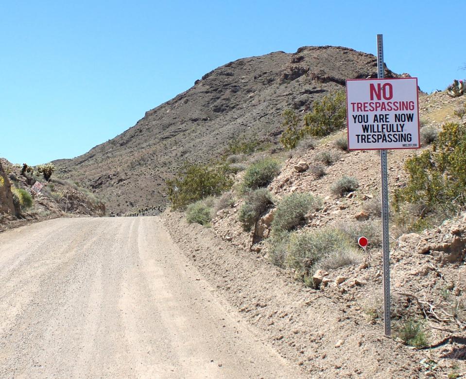 Travelers need to pay attention to certain signs posted on remote roads, as seen on April 27, 2024. Some residents take trespassing very seriously in Nelson, Nevada.
