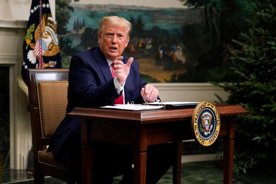 President Donald Trump speaks with reporters after participating in a video teleconference call with members of the military on Thanksgiving, Nov. 26, 2020, at the White House in Washington.