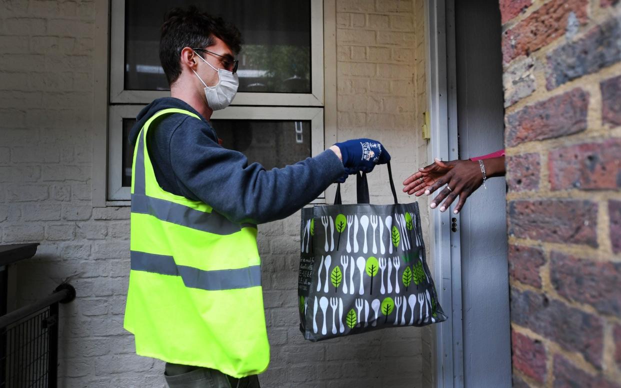 A food package is delivered to a shielding household. Many people who have been shielding are concerned about returning to their workplaces - Andy Rain/EPA-EFE/Shutterstock