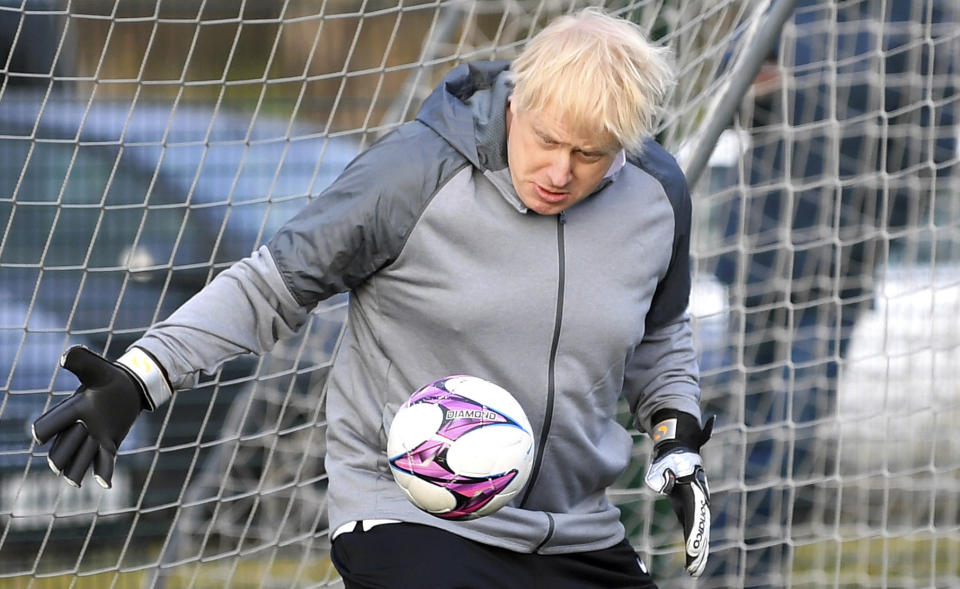 Britain's Prime Minister Boris Johnson stands in goal, prior to a Juniors girls' soccer match between Hazel Grove United JFC and Poynton.