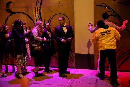 Kumar Srikantappa (C), 31, a software architect for Oracle, chats with people in line for a Gatsby-themed party in San Francisco, California, U.S. January 28, 2017. REUTERS/Gabrielle Lurie