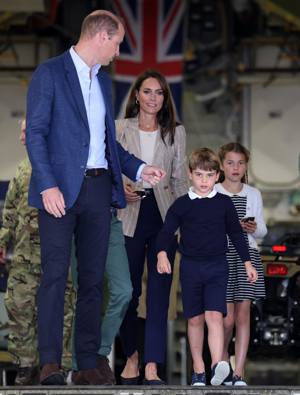 FAIRFORD, ENGLAND - JULY 14: Prince William, Prince of Wales and Catherine, Princess of Wales with Princess Charlotte of Wales and Prince Louis of Wales as they walk down the ramp of a C17 plane during their visit to the Air Tattoo at RAF Fairford on July 14, 2023 in Fairford, England. The Prince and Princess of Wales have a strong relationship with the RAF, with the Prince having served with the Search and Rescue Force for over three years, based at RAF Valley in Anglesey. The Prince is Honorary Air Commodore of RAF Coningsby and The Princess is Honorary Air Commodore of the Air Cadets. (Photo by Chris Jackson/Getty Images)