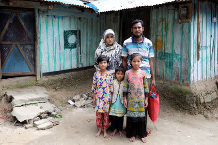 Nurul Amin, his wife Rehana Begum and their children take shelter at their relatives' house to avoid forced repatriation, at a camp in Cox's Bazar, Bangladesh, November 14, 2018. REUTERS/Mohammad Ponir Hossain