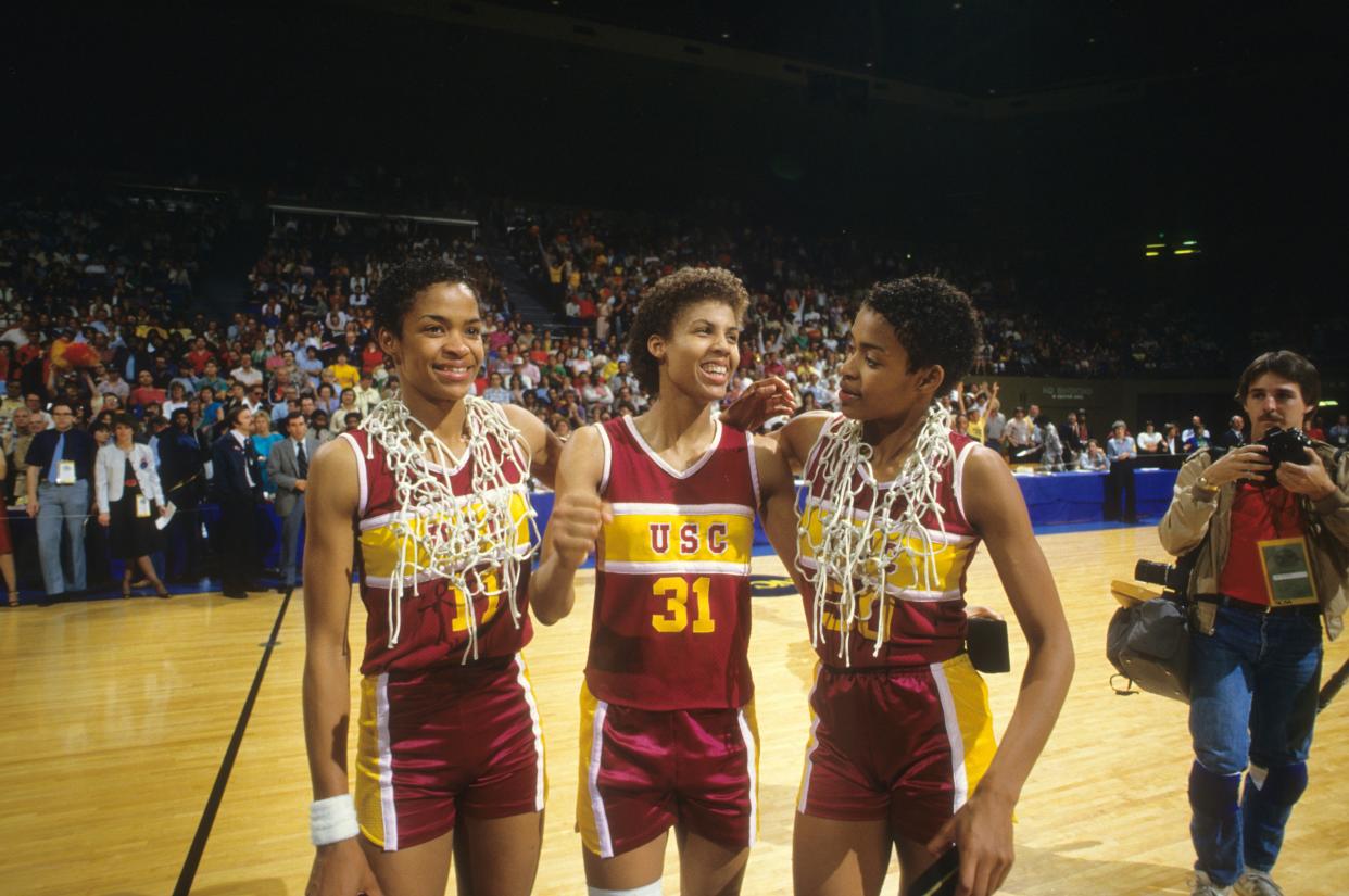 USC's Paula McGee (11), Cheryl Miller (31) and Pamela McGee (30) celebrate after winning the national championship in 1984. (Peter Read Miller /Sports Illustrated via Getty Images)