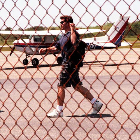 <p>Laura Cavanaugh/ZUMA</p> JFK Jr. with his airplane "Piper Club"