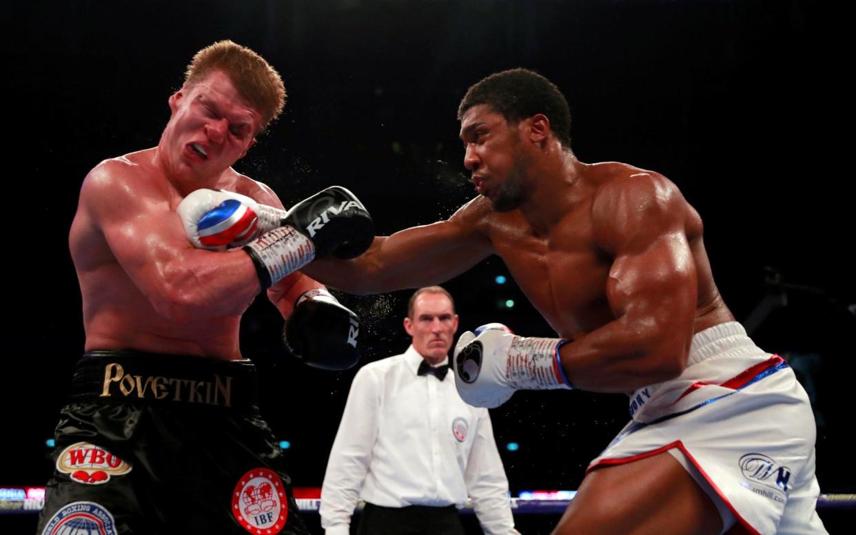 Anthony Joshua breaks through Alexander Povetkin's defences - REUTERS