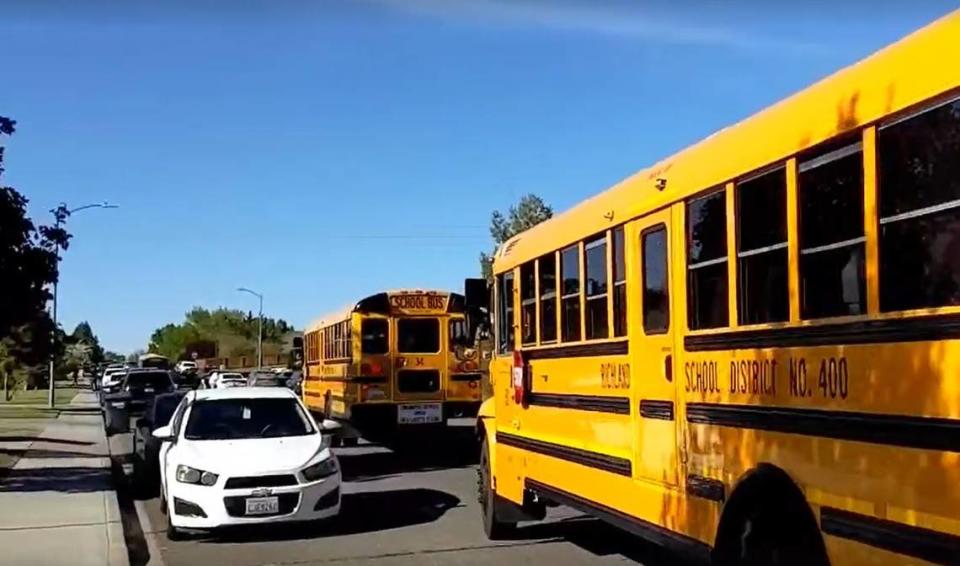 Richland School District sent buses to transport children to their parents after a woman was killed outside of William Wiley Elementary in West Richland on April 22. Eric Rosane