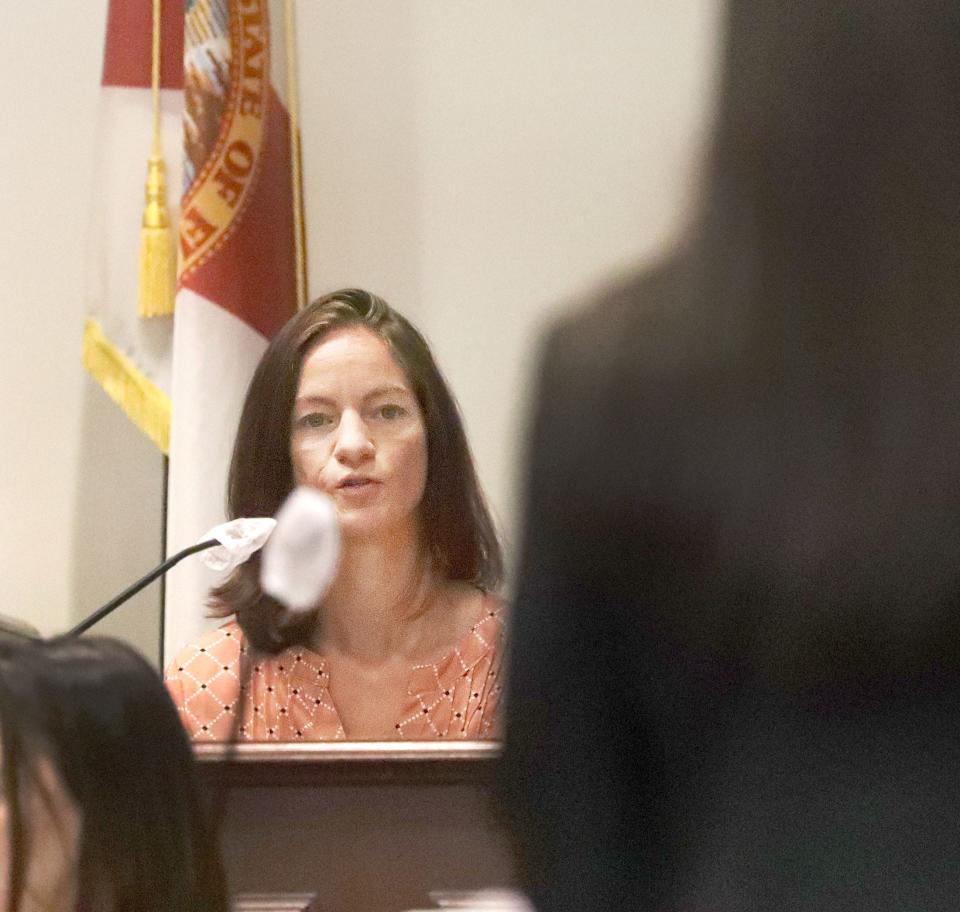 Shauna DeRousha takes the stand during her husband's Damian DeRousha's trial, Tuesday, May 17, 2022, for the shooting death of Donald Geno in 2021. Shauna DeRousha and Geno were having an affair.