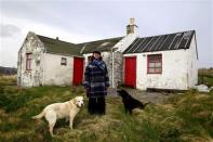 Former councillor Caroline Miller, 47, poses for a photograph near her home on the Island of Bressay situated off the east coast of mainland Shetland April 4, 2014. REUTERS/Cathal McNaughton