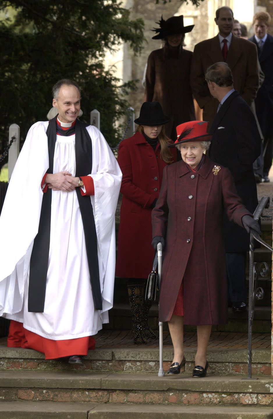 <p>In 2003, the Queen didn't let her knee surgery stop her from attending her annual family Christmas service. Pictured, she walks down the church steps with the aid of a handrail and her walking stick. </p>