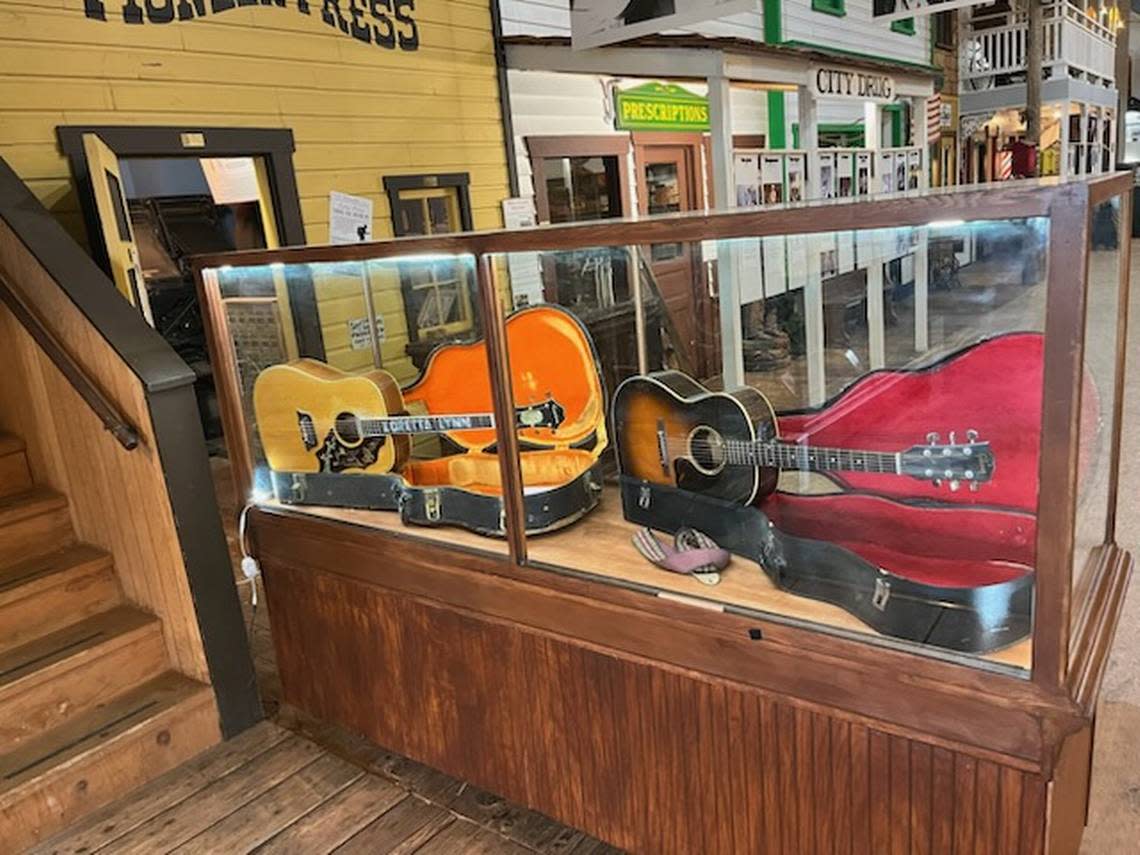 A replica of Loretta Lynn’s guitar (left) is displayed next to Darlene Little’s guitar (right) at the Lynden Heritage Museum. Daniel Schrager