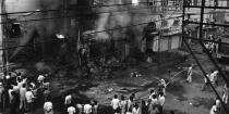 A building belonging to Sikhs burns in Daryaganj on November 2, 1984. Violence broke out in India in the wake of Prime Minister Indira Gandhi's assassination. Sikh alienation was deep and had dramatic consequences. On October 31, 1984, Indira Gandhi was assassinated by her two Sikh bodyguards, Beant Singh and Satwant Singh. The anger against Sikhs led to the terrible riots. (Photo: BEDI/AFP via Getty Images)