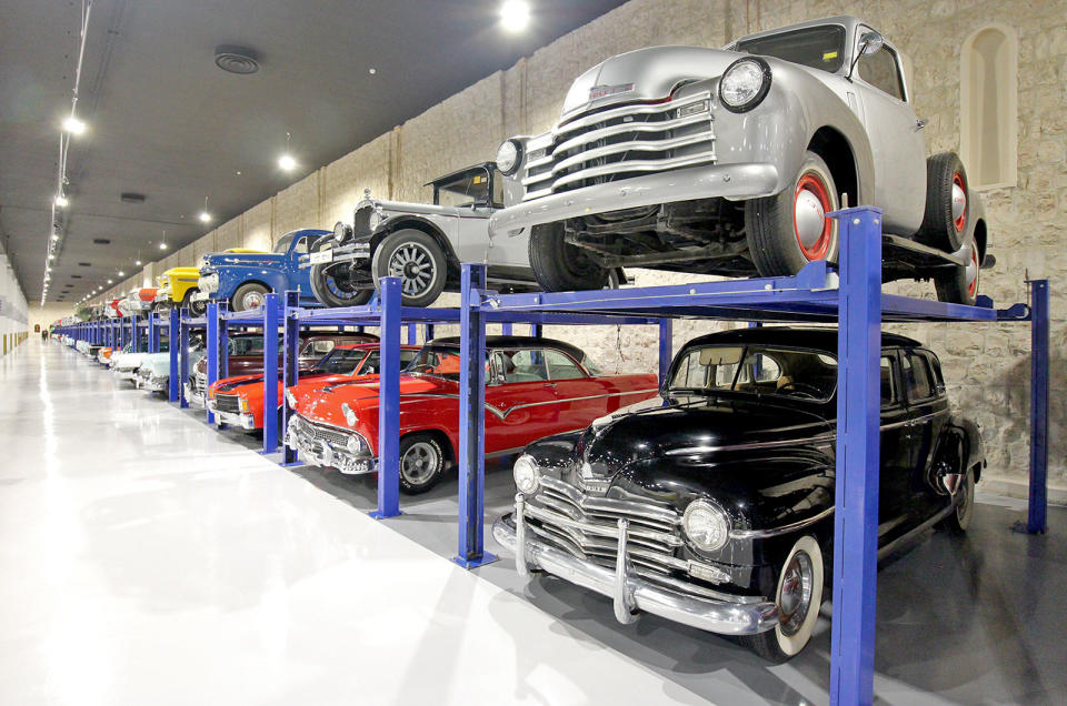 <p>The American cars in the lobby are just a taster of what's to come. The huge room that's devoted to the car collection features dozens and dozens of ramps across the back wall, which allow the cars to be displayed double-decker style as far as the eye can see.</p>