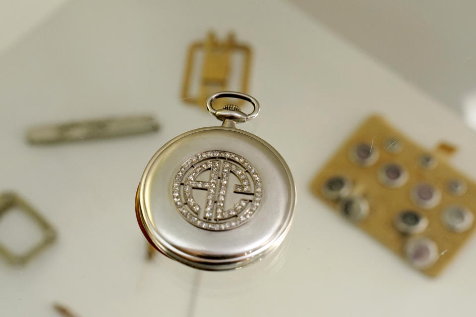 A platinum and diamond Patek Philippe pocket watch with the initials AC, that once belonged to mob boss Al Capone is seen on display at Witherell's Auction House in Sacramento, Calif., Wednesday, Aug. 25, 2021. The watch is among the 174 family heirlooms that will be up for sale at an Oct. 8 auction titled "A Century of Notoriety: The Estate of Al Capone," that will be held by Witherell's. (AP Photo/Rich Pedroncelli)