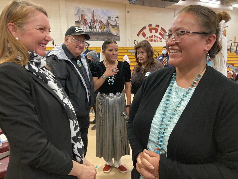 This Feb. 17, 2023 image shows chief school administrator Willinda Castillo, right, and U.S. Rep. Melanie Stansbury of New Mexico celebrating the securing of $90 million in federal funds for a new school at To'Hajiilee, New Mexico. The school is just one of dozens funded by the U.S. Bureau of Indian Education that are in desperate need of repair or replacement. The agency estimates it would cost roughly $6.2 billion to address the needs of those schools in poor condition. (AP Photo/Susan Montoya Bryan)